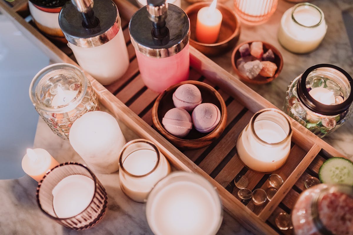 Luxury candles on wooden tray spa setting